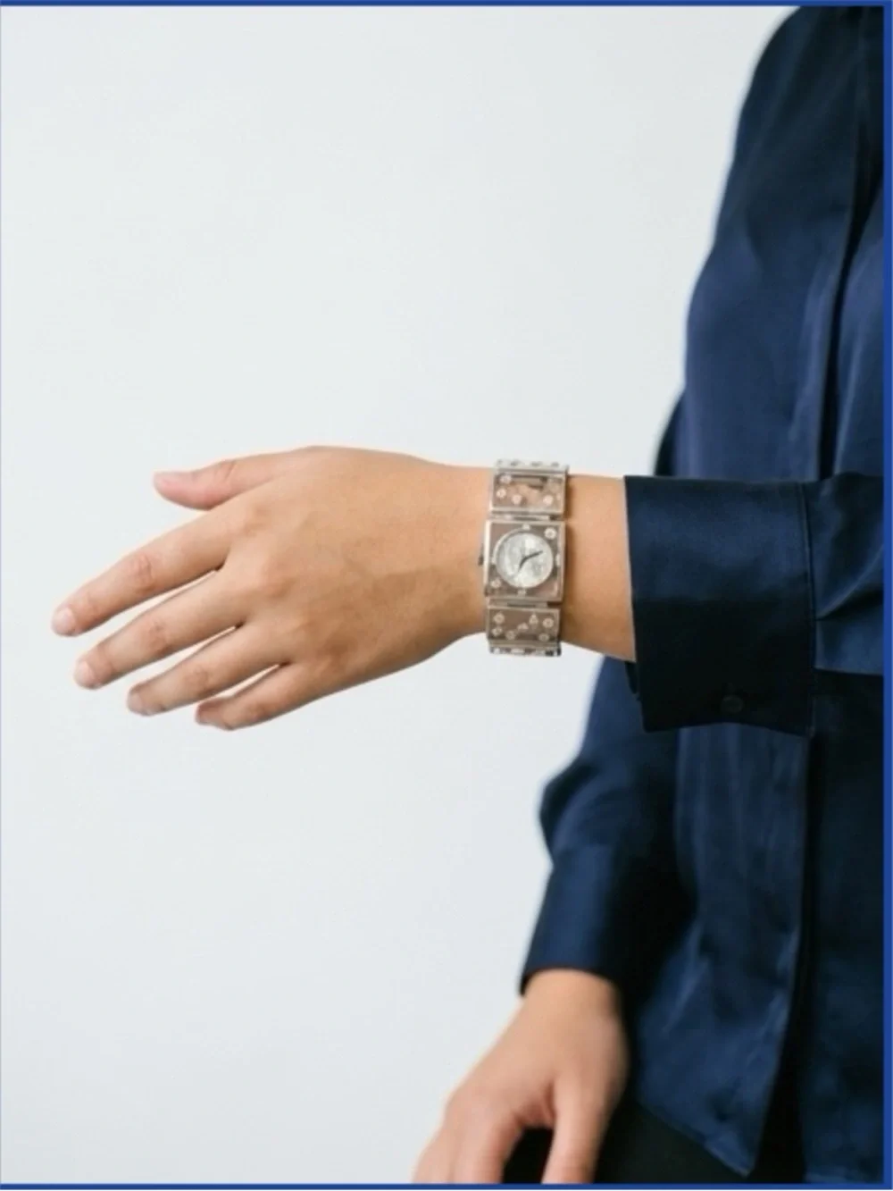 Brighton Gainesville watch features a design silver-tone butterflies & flowers.